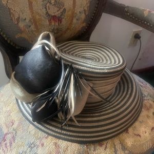 Fancy black, and gold hat with a feather